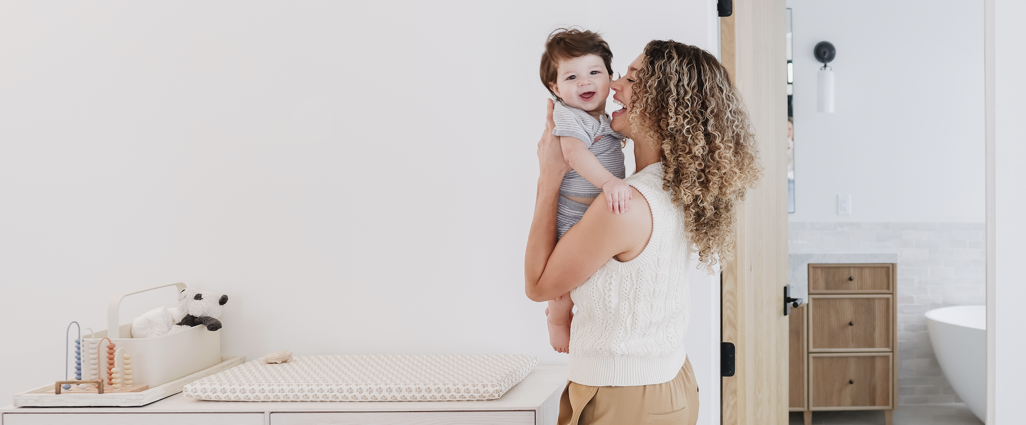 Mom playing with baby on Gathre Padded Micro+ mat. 