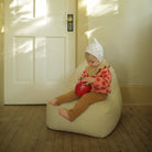 All@lifestyle image of little girl on a mini lounger