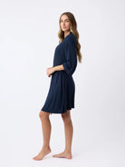 Navy@woman wearing a navy cozy earth robe