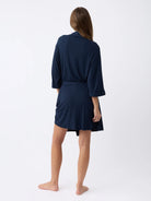 Navy@woman wearing a navy cozy earth robe