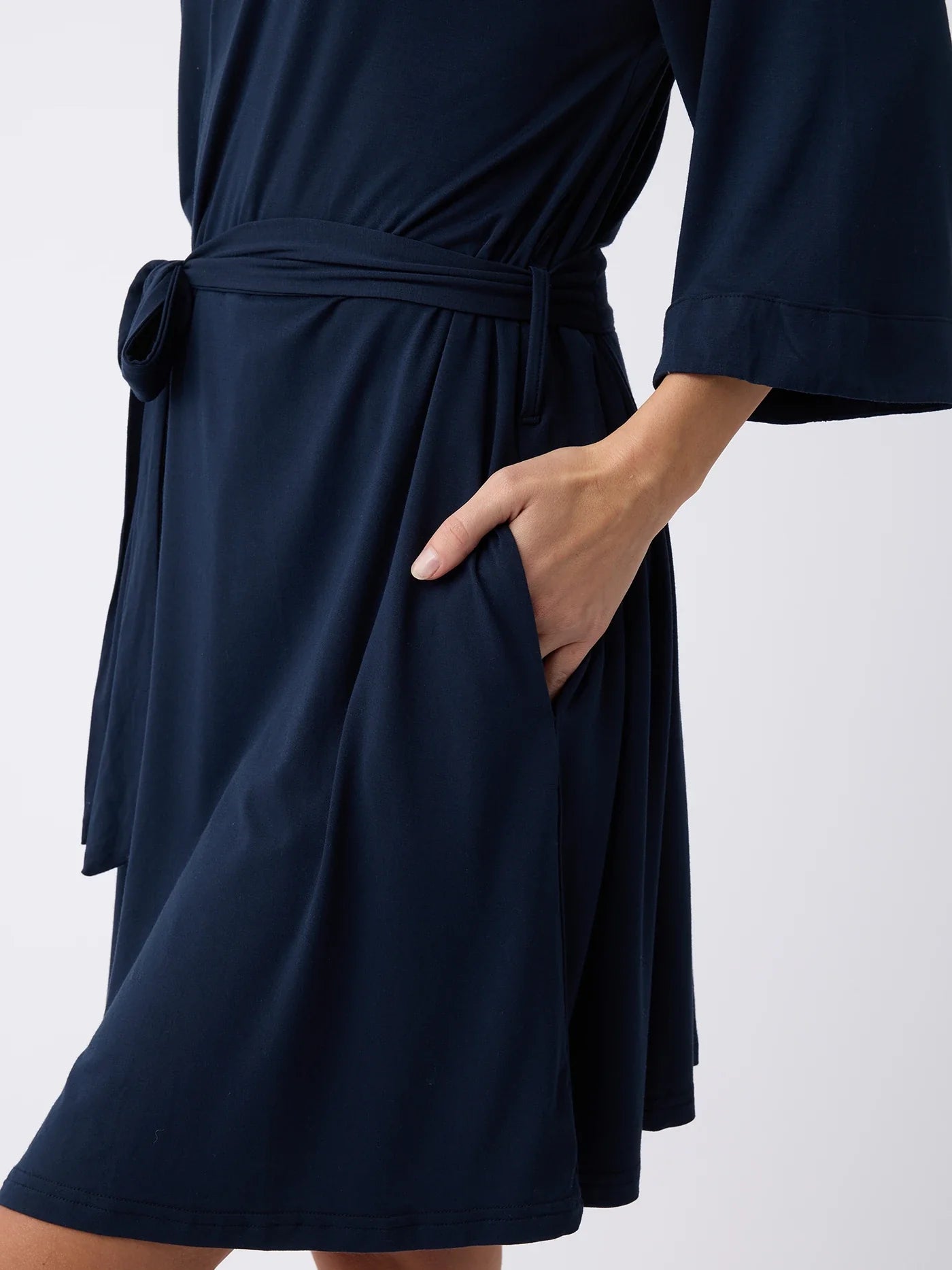 Navy@woman wearing a navy cozy earth robe