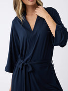 Navy@woman wearing a navy cozy earth robe