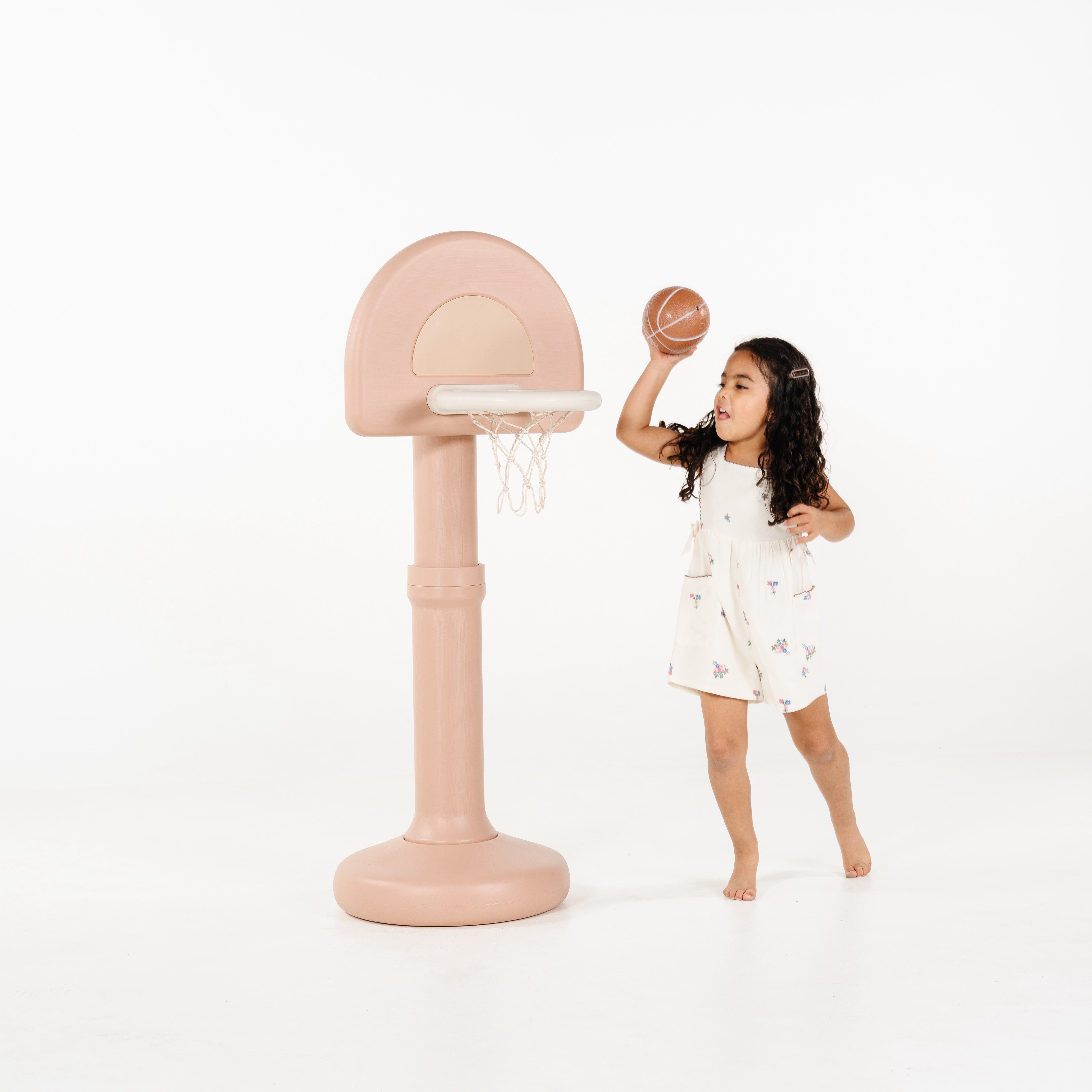 Tulle@Toddler using a basketball hoop to practice coordination and movement