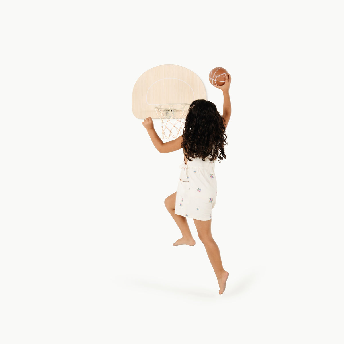 Ivory@Child using an over-the-door basketball hoop for indoor practice