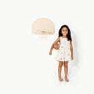 Ivory@Child using an over-the-door basketball hoop for indoor practice