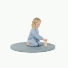 Amalfi / Circle@little girl playing on padded mat
