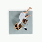 Amalfi / Sqaure@overhead of little girl playing on padded mat
