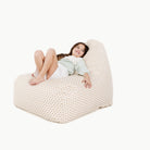 Bloom (on sale)@kid sitting on the bloom lounger