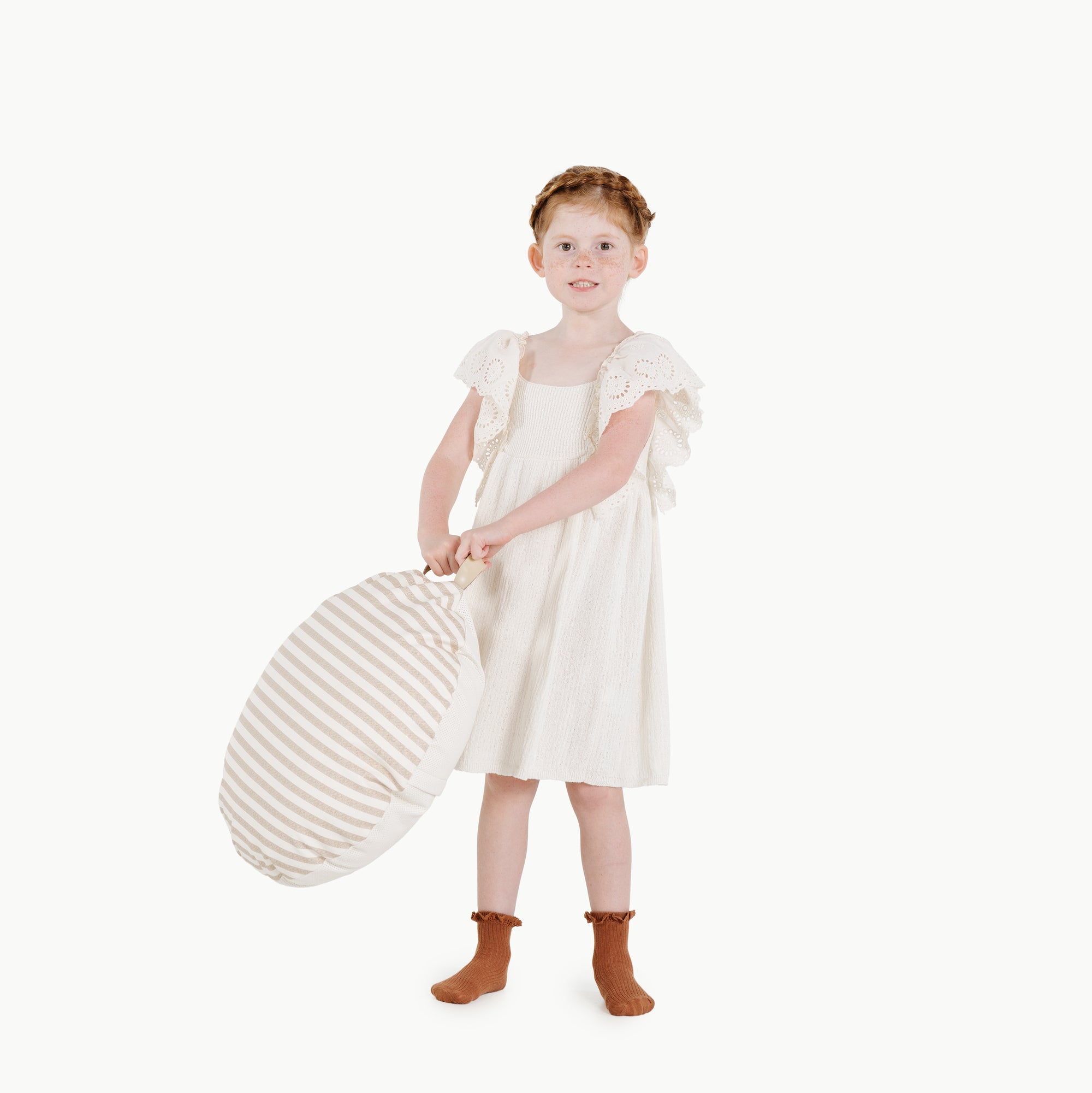 Cafe Stripe / Circle@kid holding the cafe stripe mini circle floor cushion