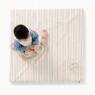 Cafe Stripe / Square@overhead of kid playing on the cafe stripe padded mini square