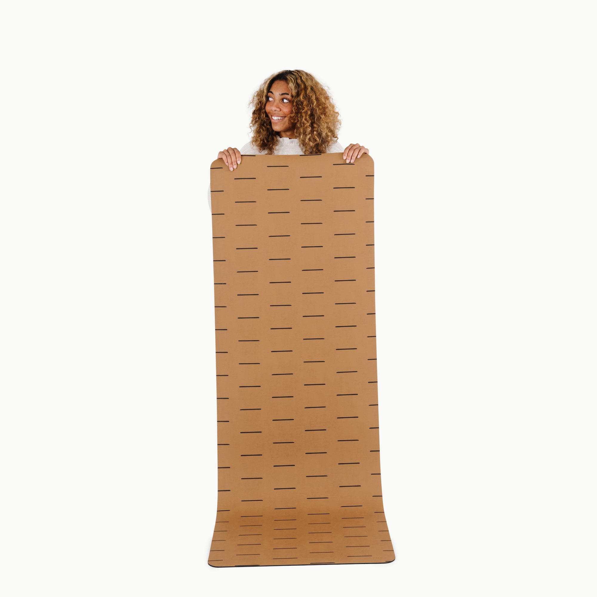 Camel Dash (on sale)@Woman holding the large camel dash home mat