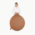 Cedar (on sale)@woman holding floor cushion