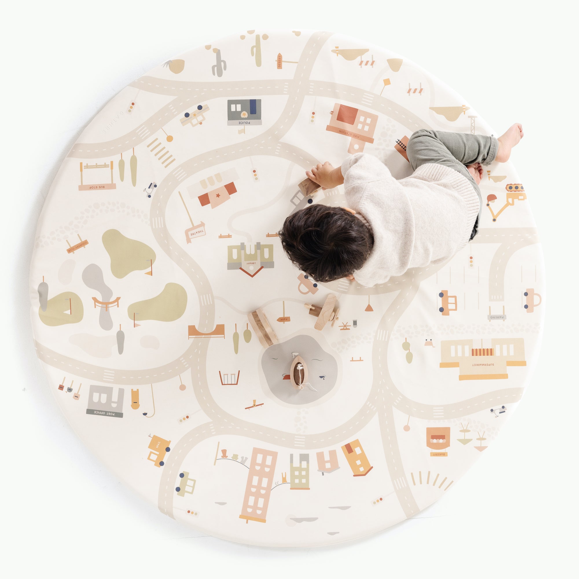 Commons@Overhead of little boy playing on Midi Circle mat