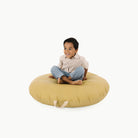 Soleil (on sale) / Circle@kid sitting on the soleil circle floor cushion