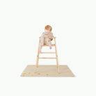 Créme@baby in high chair on mat