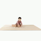 Créme@little boy on padded mat