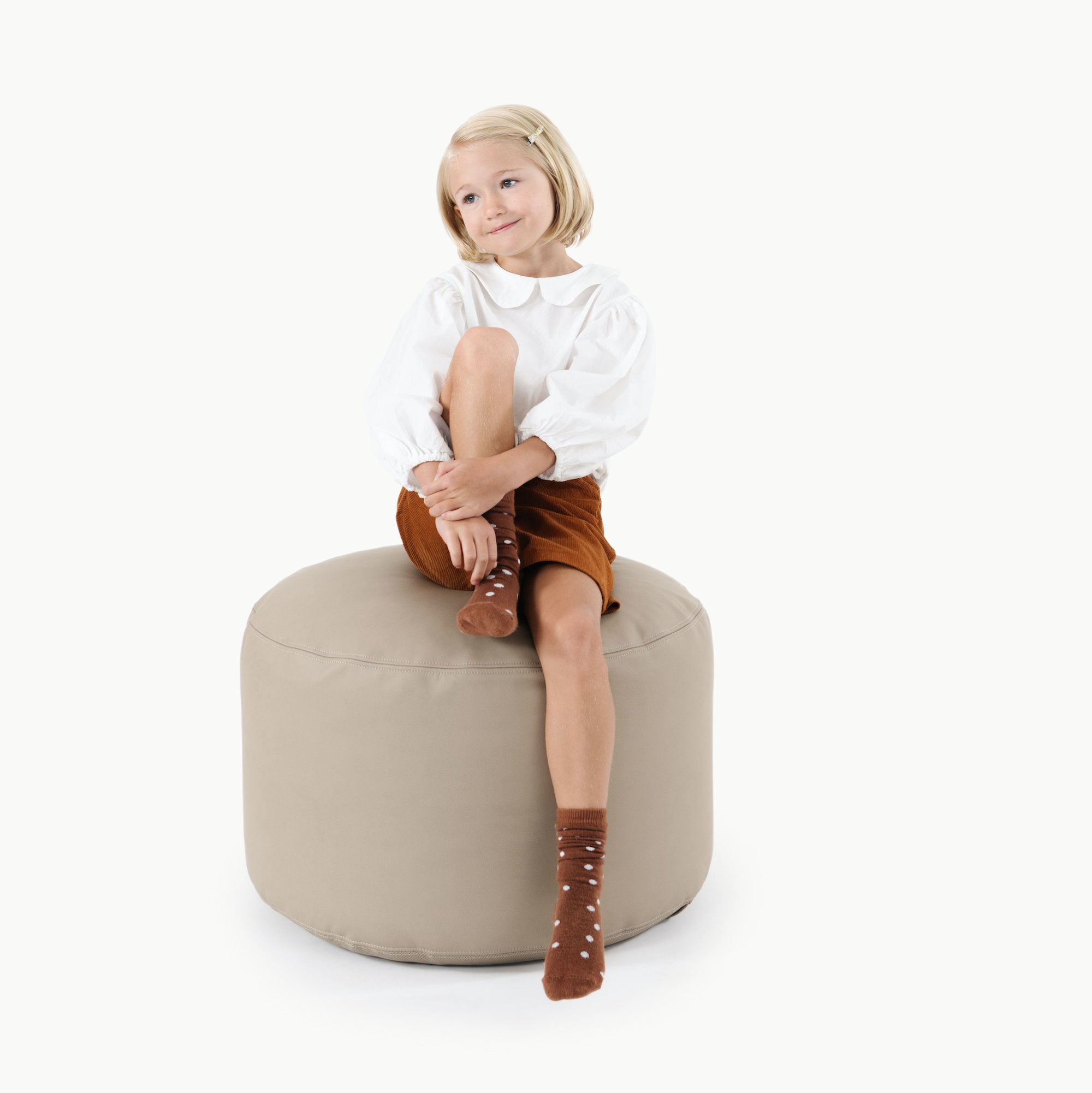 Ember (on sale)@kid sitting on the ember circle pouf