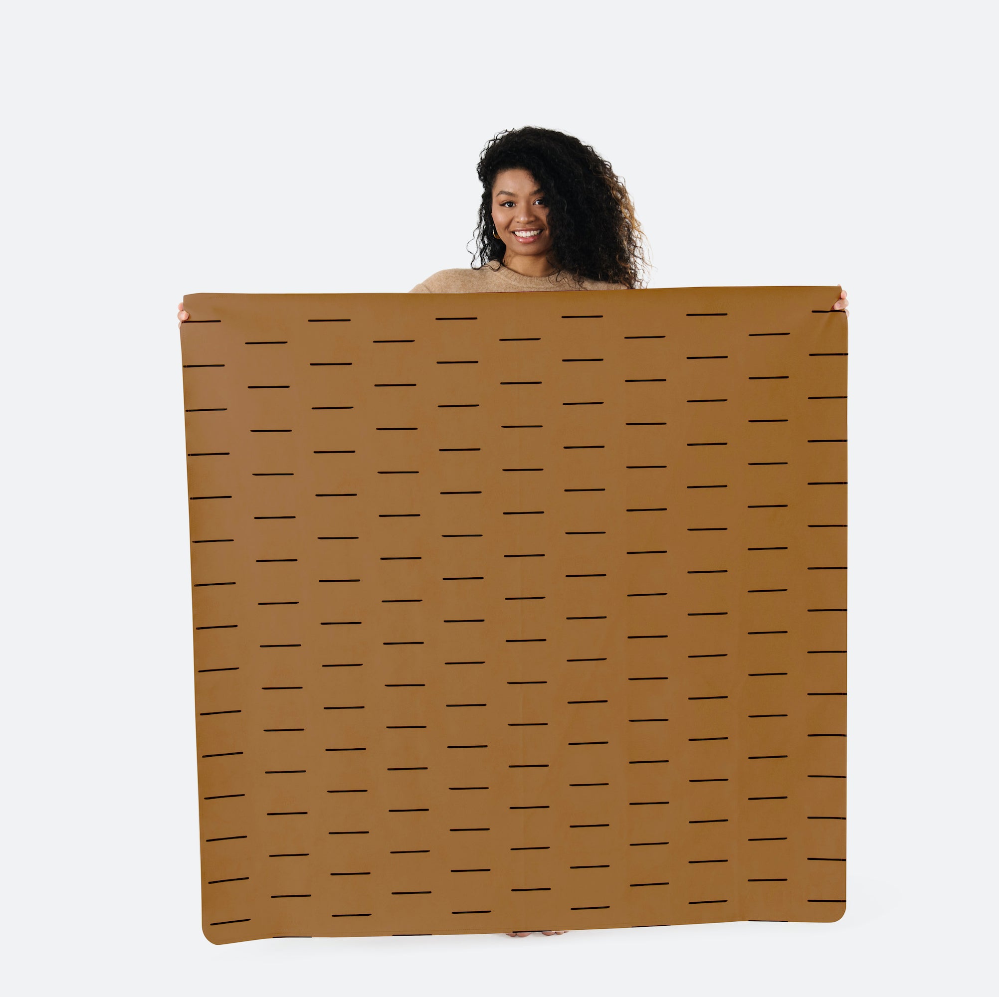 Camel Dash (on sale) / Square@woman holding up the sienna midi circle mat