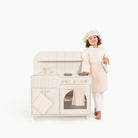 Ivory@Play Chef Dress-Up Set with a little girl and the play kitchen