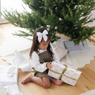 Ivory Scallop (on sale)@Kid opening gift near tree with Ivory Scallop Tree Skirt under it 
