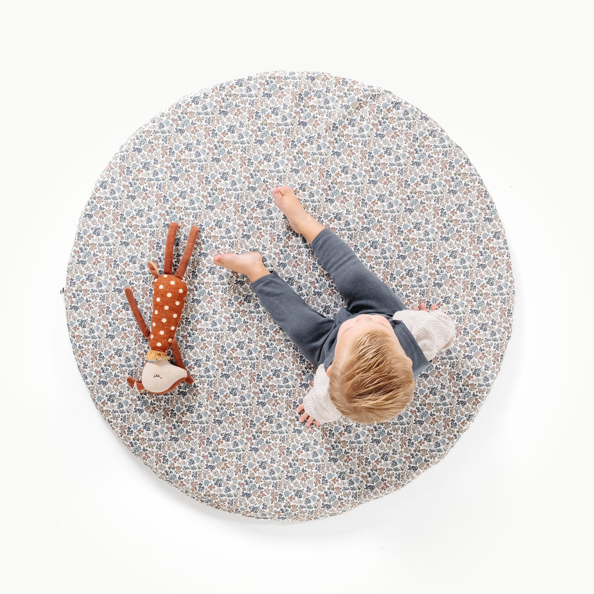 Joanna Bloom / Circle@overhead image of little boy on padded mini