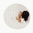 Meadow / Circle@overhead of kid sitting on the meadow circle quilted mat