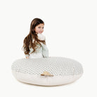 Meadow (on sale) / Circle@kid sitting on the meadow circle floor cushion