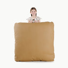 Ochre (on sale) / Square@Kid holding the Ochre Square Floor Cushion