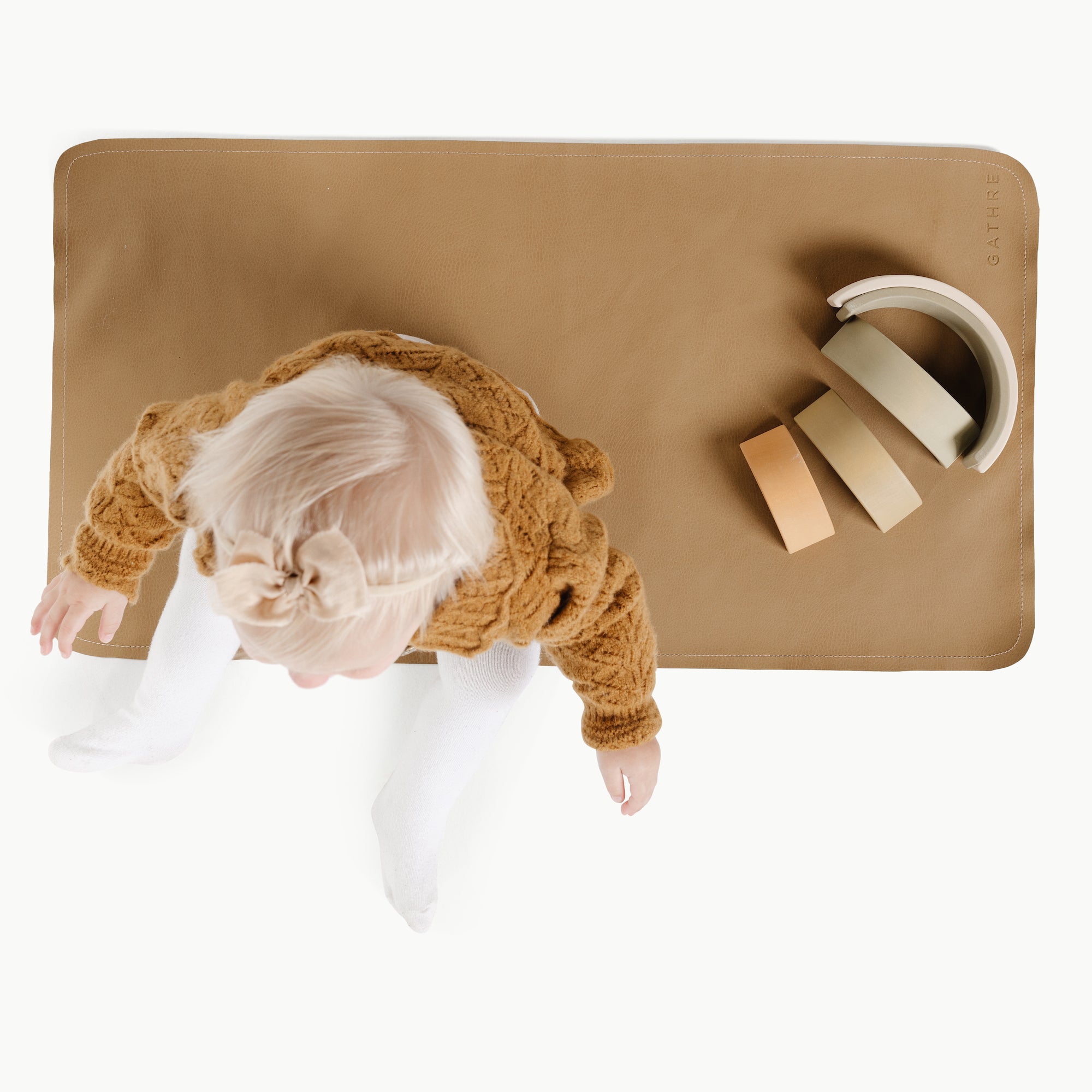 Ochre (on sale)@Overhead of a baby on the Micro+ Ochre Mat