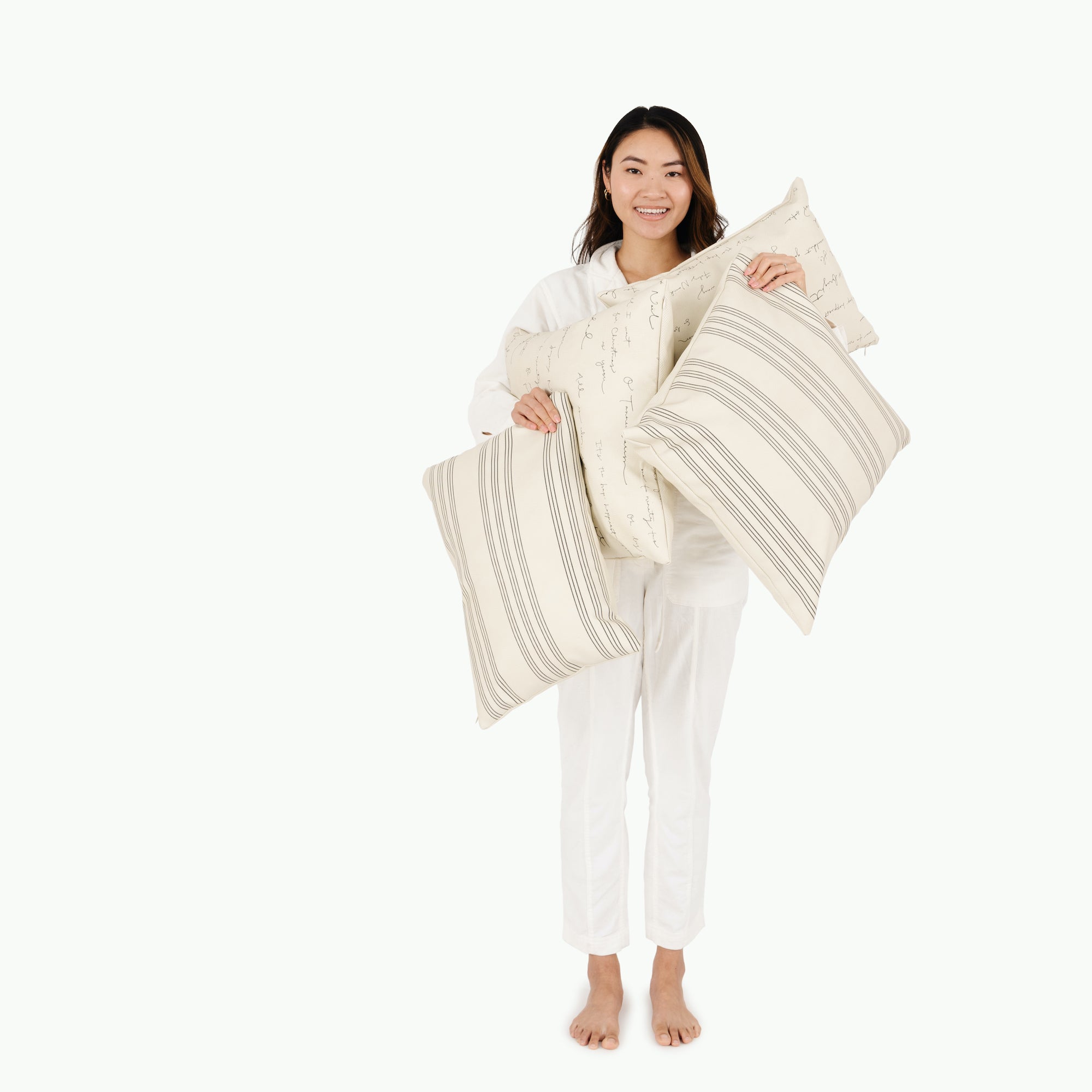 Pencil Stripe (on sale)@woman holding pillows