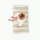 Pencil Stripe (on sale)@overhead of baby sitting on the pencil stripe padded micro+