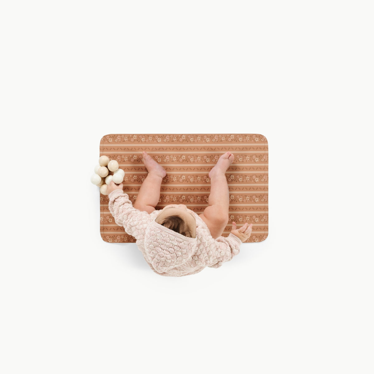 Floral Stripe@overhead image of baby on the floral stripe micro changing mat