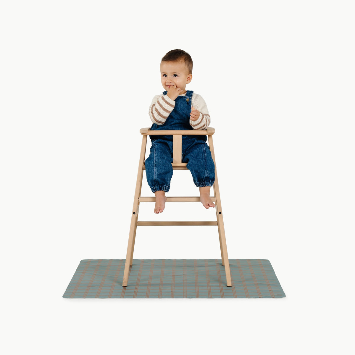 Rustic Plaid@child in a highchair on the mini mat