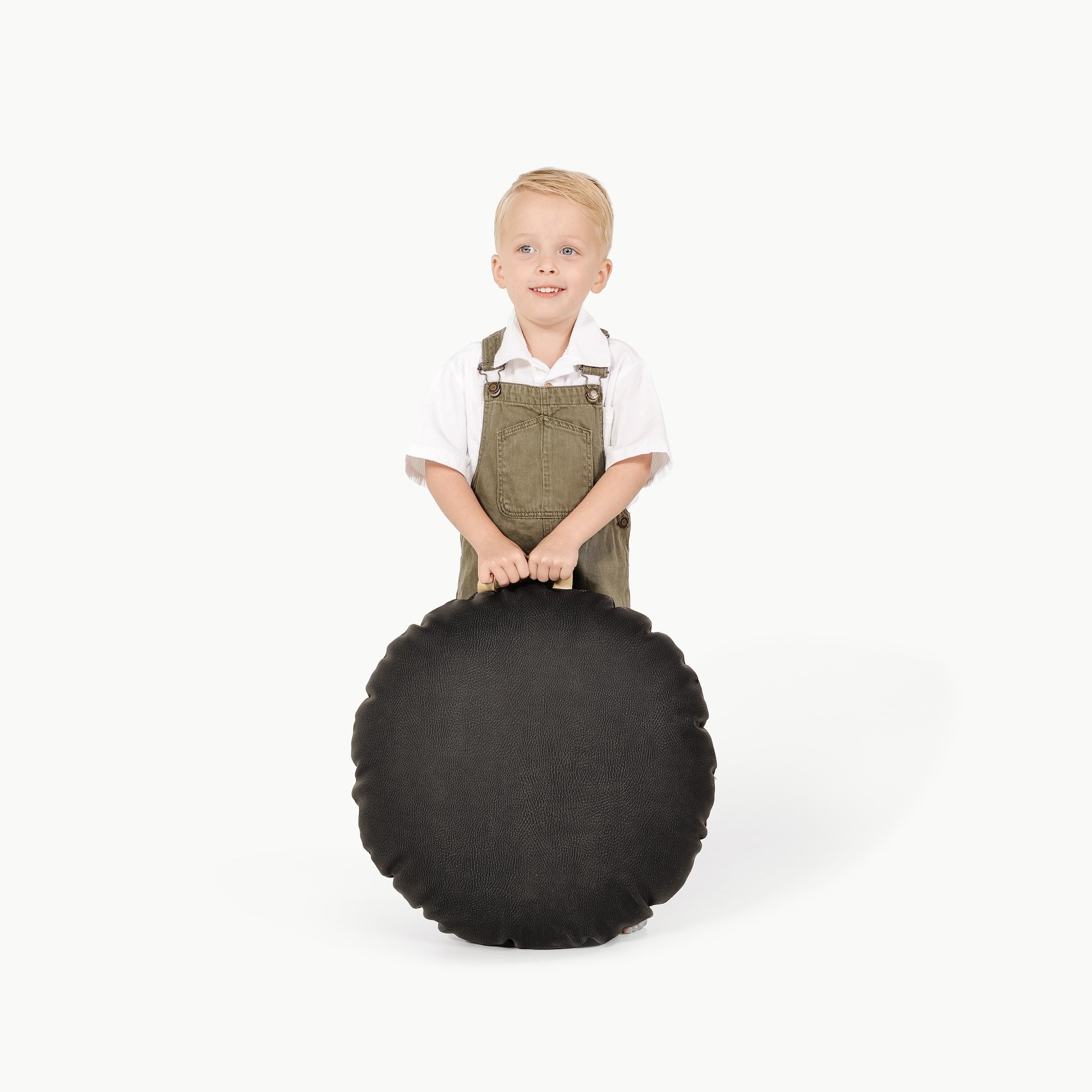 Raven / Circle@Little Boy holding the Raven Mini Circle Floor Cushion 