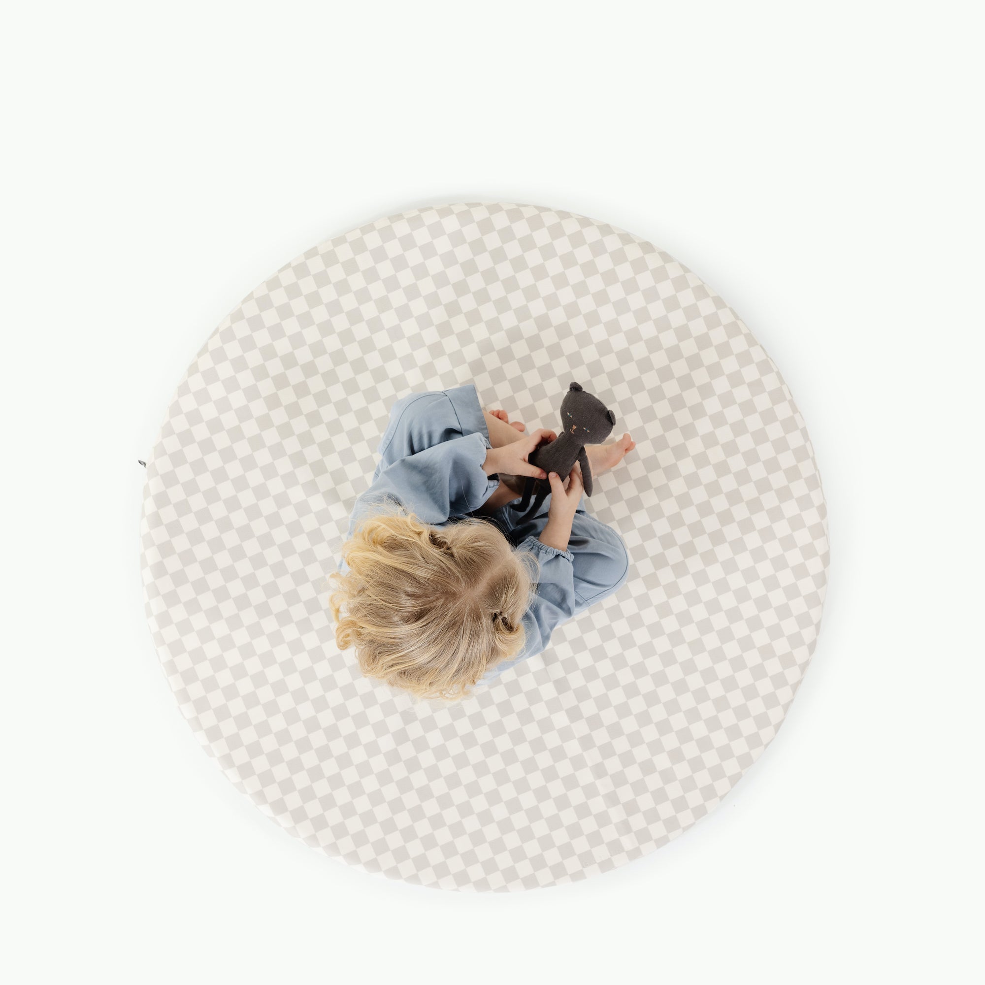 Rook / Circle@overhead of little girl playing on padded mat