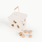 Ivory@ detail image of the wooden shape sorter