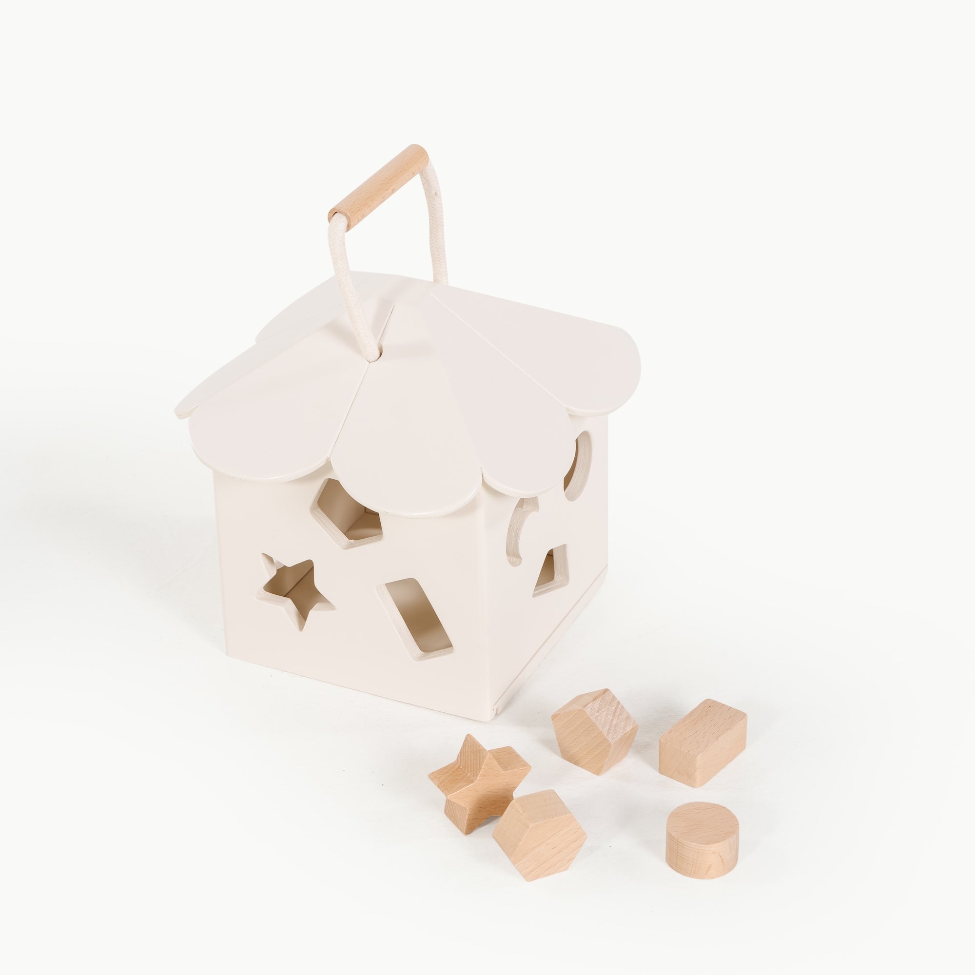 Ivory@ detail image of the wooden shape sorter