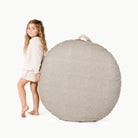 Stone Stripe / Circle@little girl holding  the Stone Stripe Circle Floor Cushion