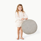 Stone Stripe / Circle@Little girl holding the Stone Stripe Mini Circle Floor Cushion