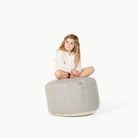 Stone Stripe / Circle@Little girl sitting on Stone Stripe Circle Pouf