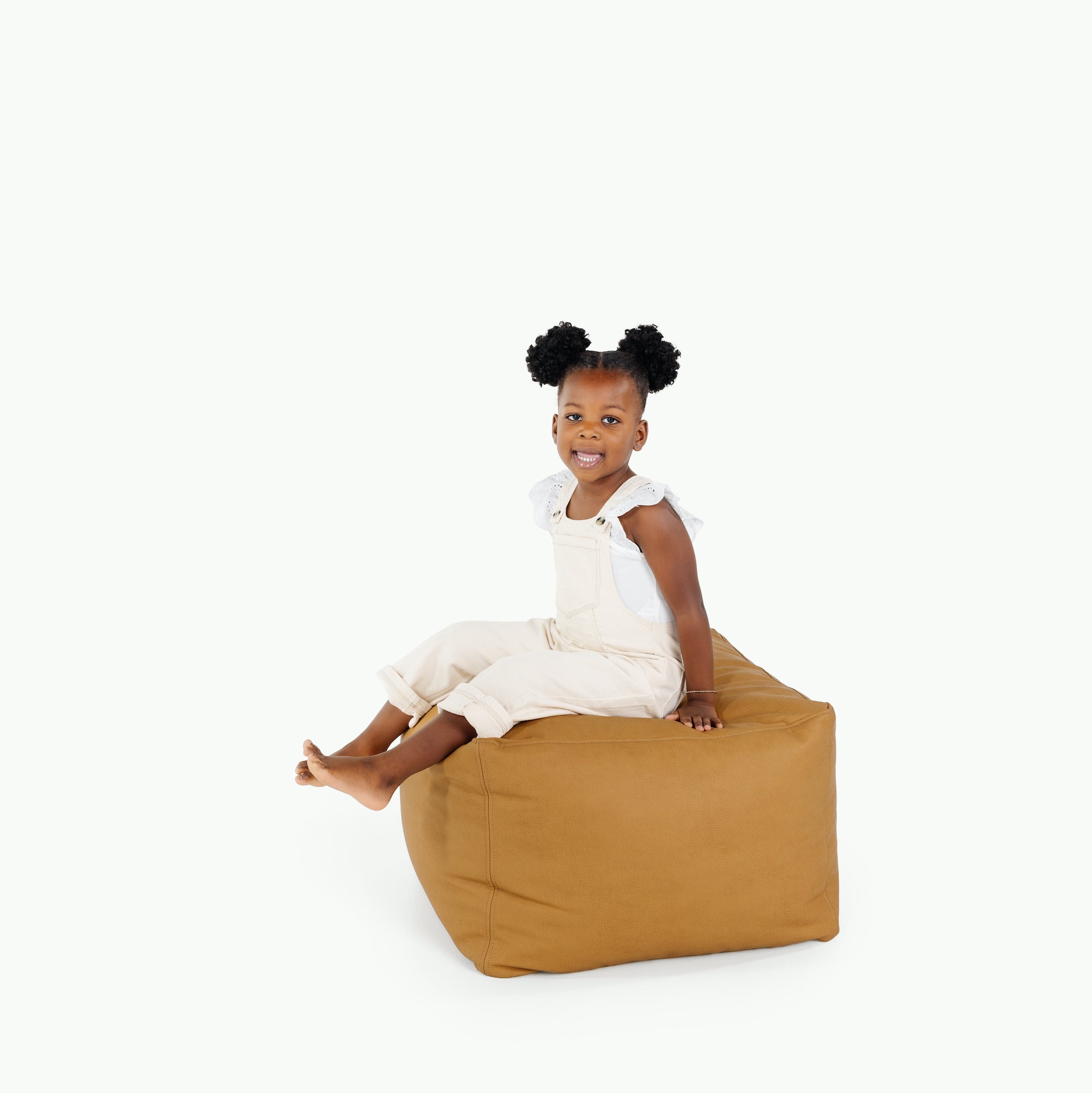 Tassel / Square@little girl sitting on pouf