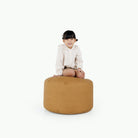 Tassel / Circle@little girl sitting on pouf