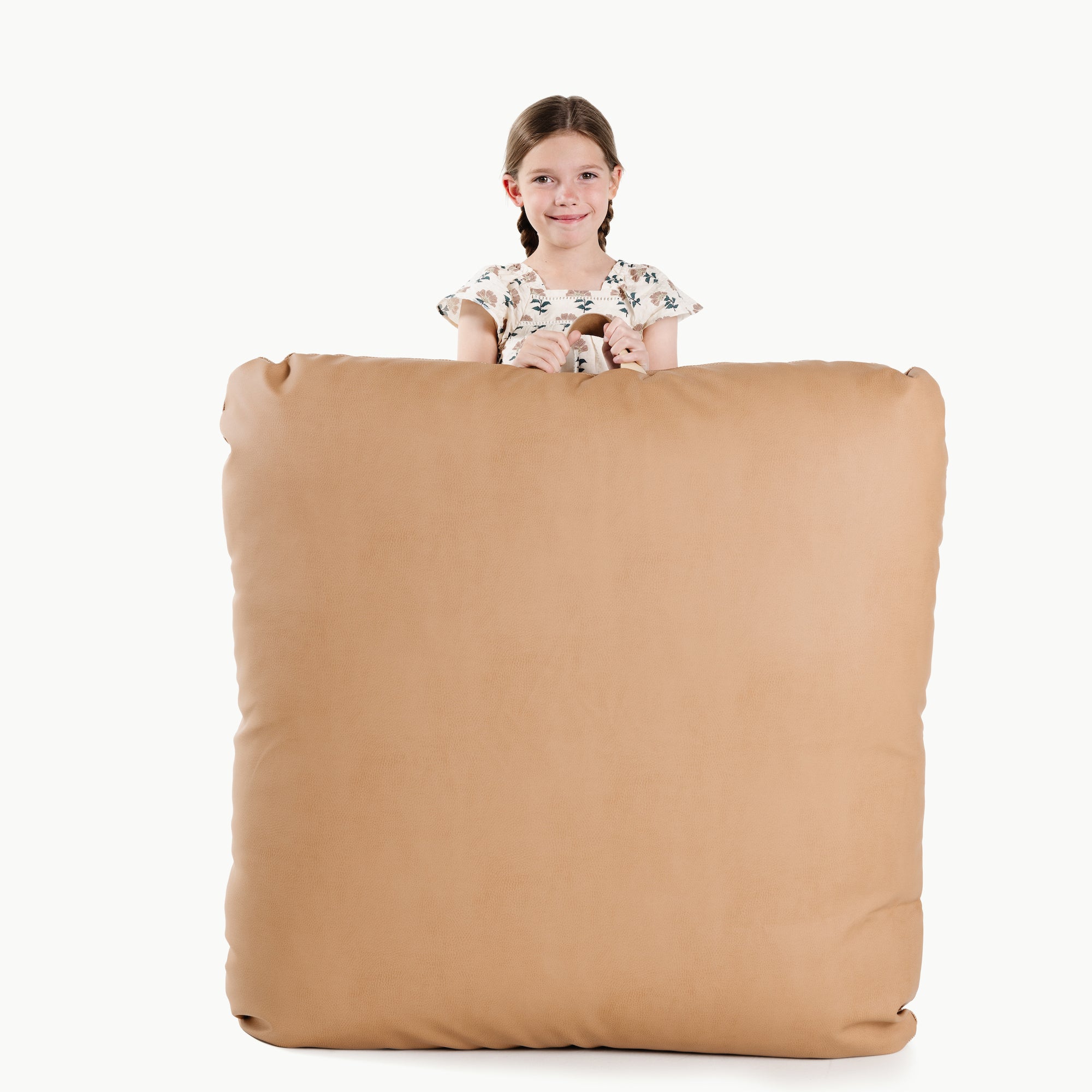 Terra (on sale) / Square@Kid holding the Terra Square Floor Cushion