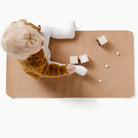 Terra (on sale)@Overhead of a baby on the Micro+ Terra Mat