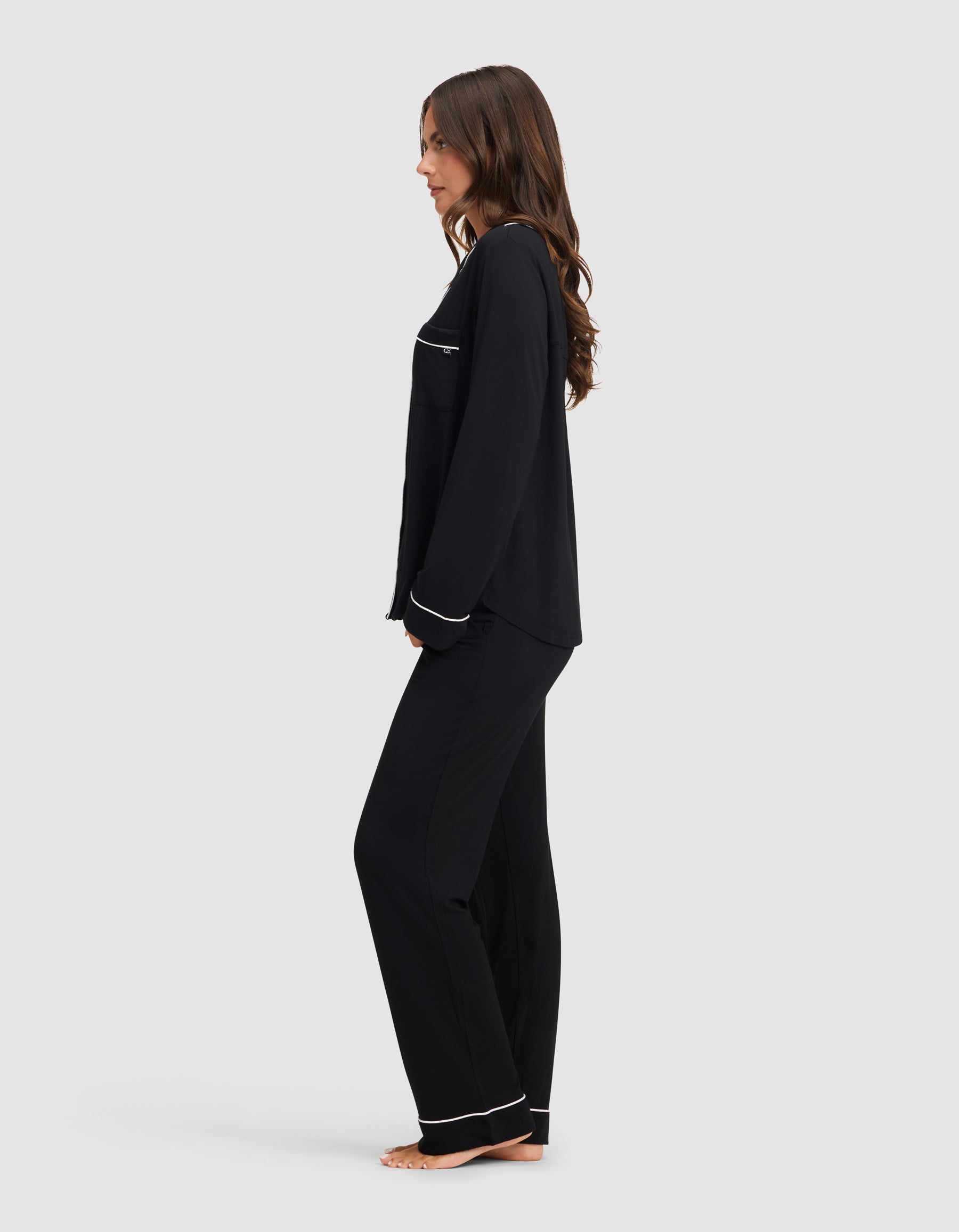 Black@woman wearing black cozy earth pajamas