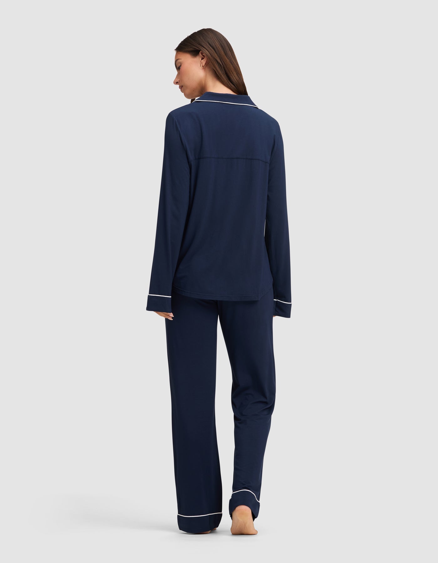 Navy@woman wearing navy cozy earth pajamas