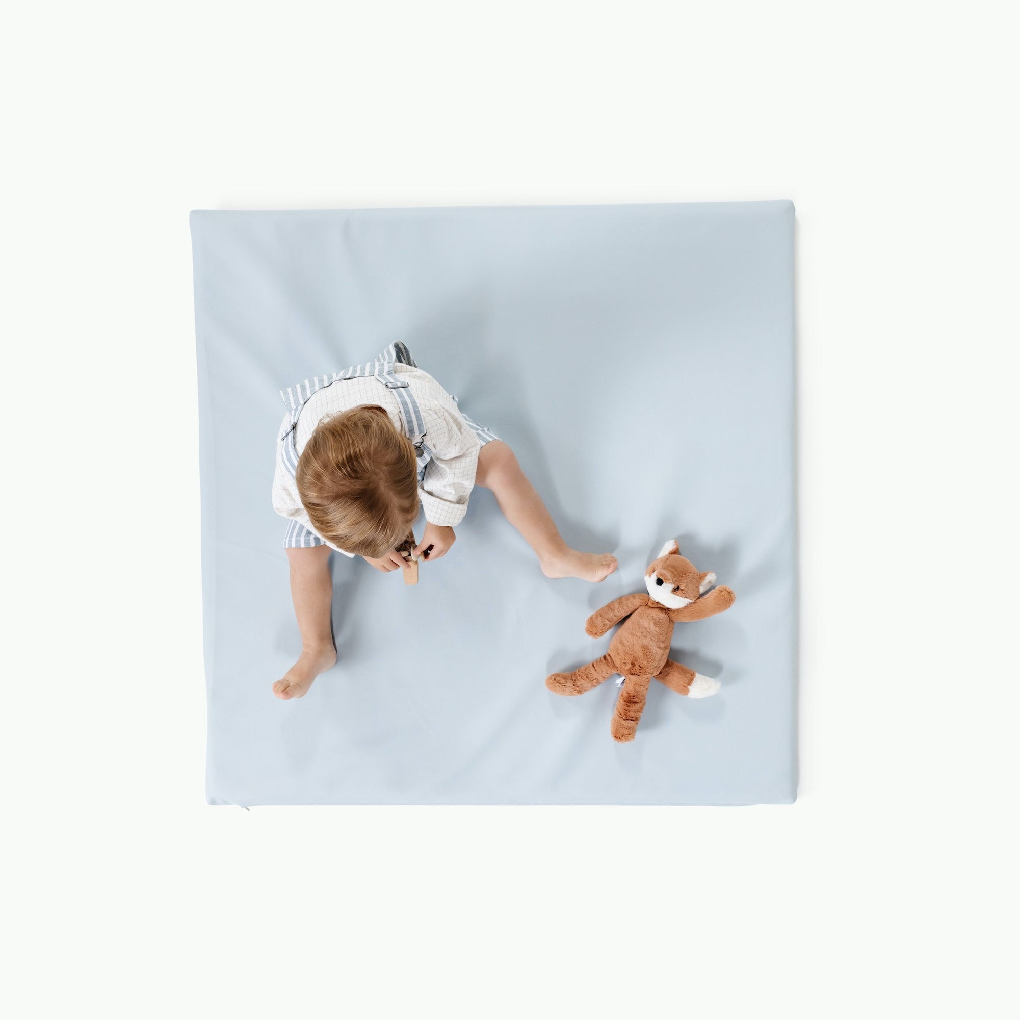 Beau / Square@Overhead of kid sitting on Beau Padded Mini Square