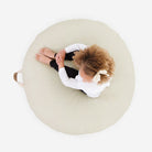 Blanc (on sale) / Circle@Overhead of kid sitting on the Blanc Circle Floor Cushion
