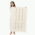 Ivory (on sale)@Woman holding the Large Ivory Advent Calendar