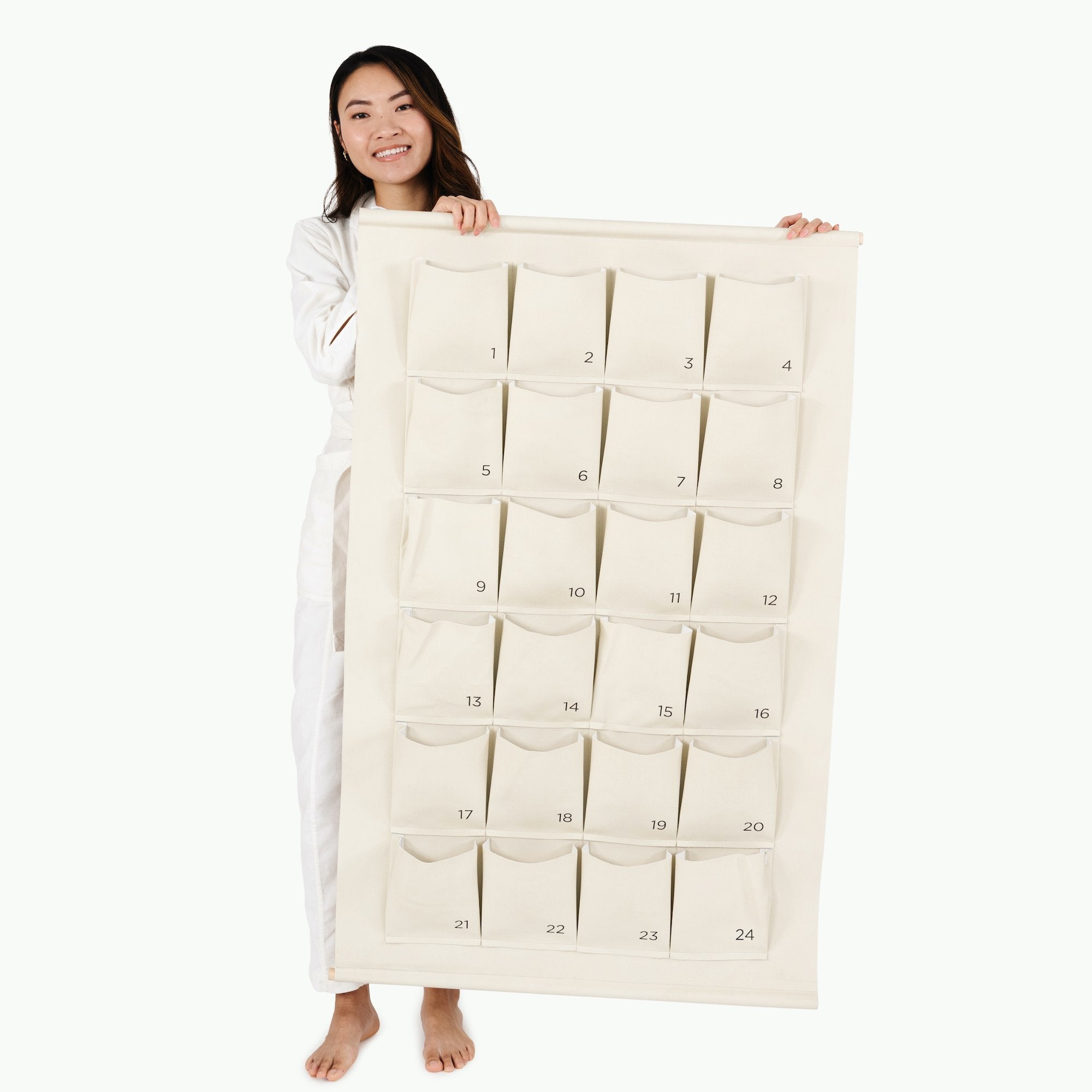 Ivory@woman holding the ivory large advent calendar